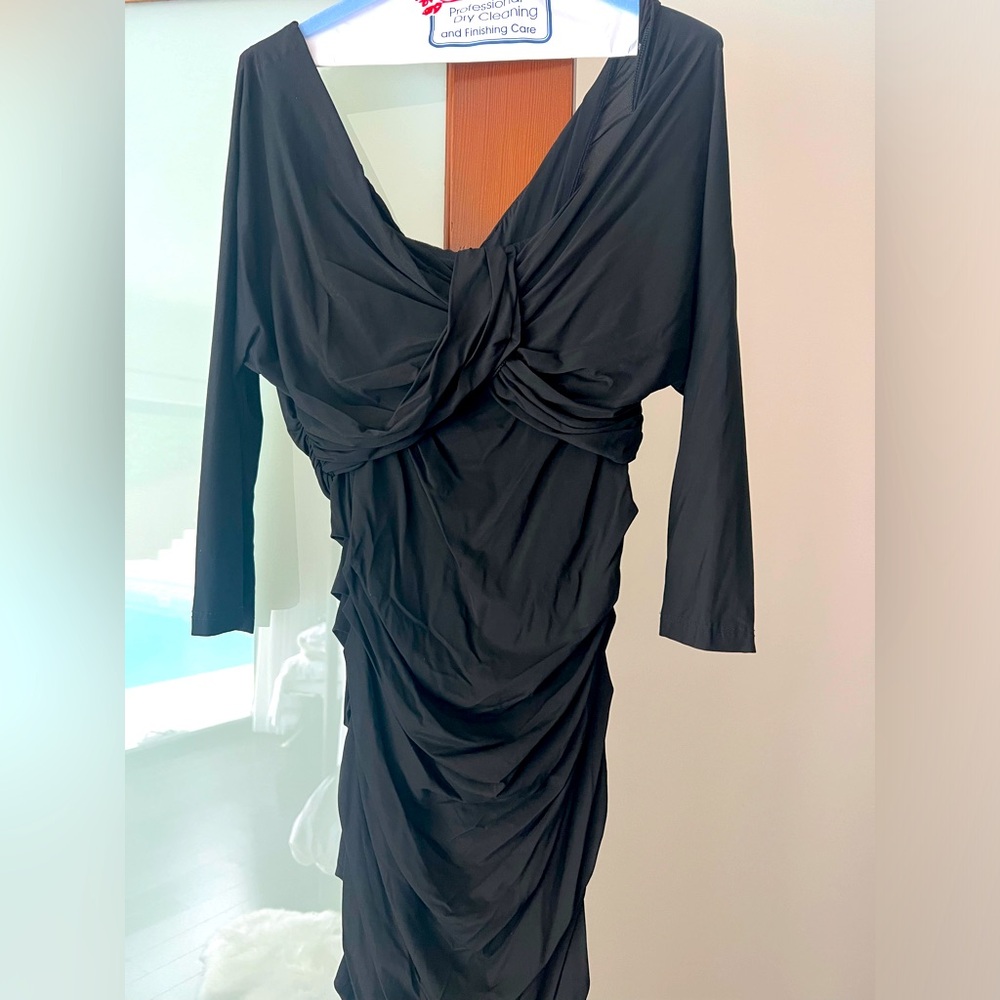 SOLD black ruched Dolce and Gabbana dress. No size tag but fits like a size 4-6.